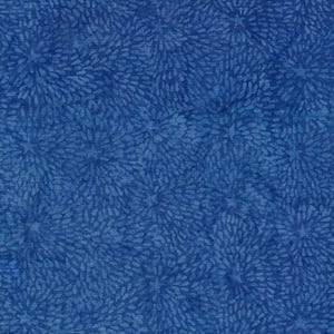 May include: A fabric featuring a deep blue background with a repeating pattern of lighter blue, petal-like shapes arranged in circular, starburst-like clusters. The design has a mottled, watercolour-like texture throughout the entire surface.