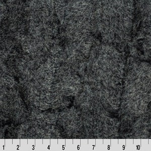 May include: A close-up of a dark gray faux fur fabric with a soft, fuzzy texture.