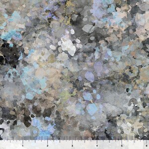 May include: Abstract watercolor fabric with a mottled pattern in shades of gray, black, blue, and beige. The design features overlapping shapes and splatters, creating a textured effect. A ruler is visible along the bottom edge, with markings in inches.