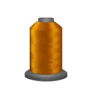 May include: A spool of bright orange thread for sewing or embroidery.