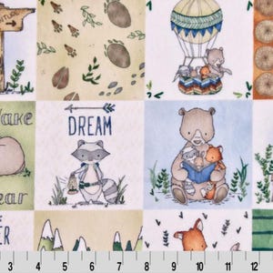 May include: A colorful fabric with a repeating pattern of woodland animals, including bears, raccoons, foxes, and bunnies. The fabric also features text such as "Don't Wake the Bear", "Dream", and "Discover".