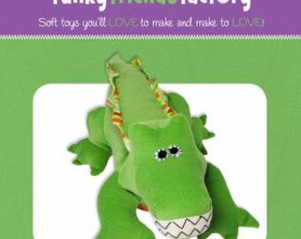 May include: A green soft toy crocodile, named Steve, with a white belly and a stitched mouth. The toy is 17 inches long. The image includes the text "funky friends factory" and "Soft toys you'll LOVE to make and make to LOVE!"
