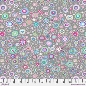 May include: A gray fabric with a repeating pattern of colorful circles. The circles are various sizes and have different colors and patterns. The fabric is a light gray with a subtle texture.