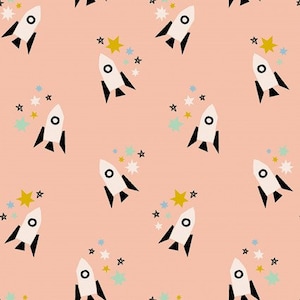 May include: A seamless pattern featuring white rockets with black accents, flying through a pink sky with colorful stars.