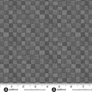 May include: A gray fabric featuring a repeating checkerboard pattern of alternating light and dark squares, each filled with fine, multidirectional cross-hatch lines. A white ruler measuring 7 inches is visible along the bottom edge.