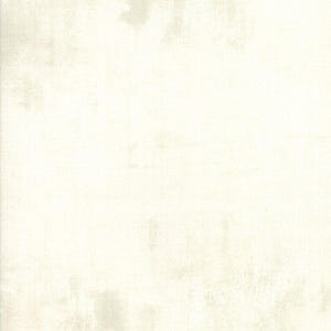 May include: A plain white fabric with a subtle texture. The fabric has a slightly off-white hue.