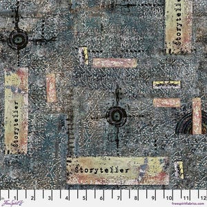May include: A fabric swatch with a dark blue and gray textured background featuring the word Storyteller printed on rectangular patches. The design includes black circular symbols with radiating lines and a ruler showing 12 inches at the bottom.
