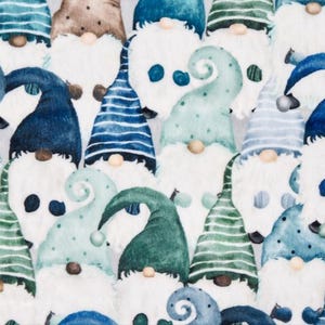 May include: A white background with a repeating pattern of blue and green gnomes with white beards. The gnomes have different colored hats with white polka dots, stripes, and swirls.