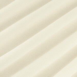May include: A close-up of a smooth, off-white fabric with a subtle, diagonal ribbing pattern. The fabric has a soft, luxurious feel.