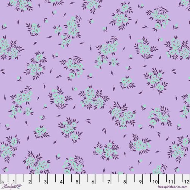 May include: A floral fabric with a lavender background. The pattern features clusters of small, light teal flowers with dark purple leaves and accents. The fabric is measured in inches.