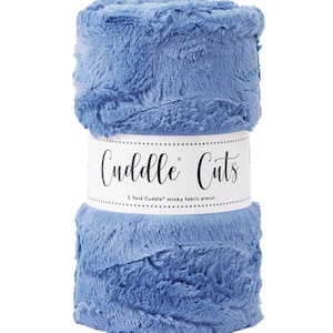 May include: A roll of blue minky fabric, 2 yards long, labeled "Cuddle Cuts".