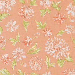May include: Close-up of a fabric with a repeating floral pattern. The design features white and peach-coloured flowers with green leaves on a peach background. The flowers vary in size and style, creating a textured look.