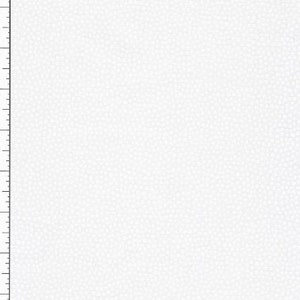 Puede incluir: Primer plano de una superficie blanca texturizada con una regla en el lado izquierdo. La superficie tiene un patrón de pequeñas formas irregulares, creando una apariencia sutil y granulada. La regla está marcada con incrementos numerados.