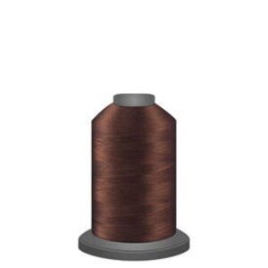 May include: A spool of brown thread for sewing or embroidery.