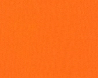 May include: Solid orange fabric with a subtle textured pattern. The bright, uniform color fills the frame, creating a vibrant and eye-catching visual.