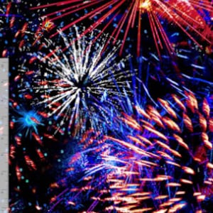 May include: A vibrant fireworks display with red, white, and blue bursts against a black night sky.