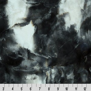 Könnte beinhalten: Schwarz-weißer Kunstpelzstoff mit Marmorierung. Der Stoff hat eine weiche, plüschige Textur.