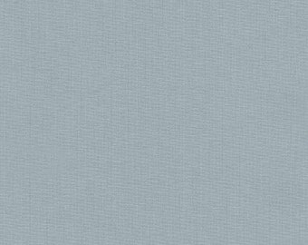 May include: A close-up shot of a light blue fabric with a textured weave. The material has a subtle, even color and a slightly rough surface, suggesting a linen or similar textile. The overall appearance is simple and clean.