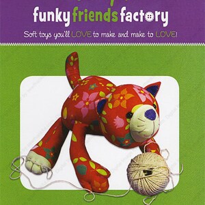 May include: A red and green patterned soft toy cat with a ball of yarn. The cat is 13 inches tall and is called "KITTY Kate".