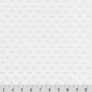 May include: White fabric with a textured pattern of small, raised circles. The fabric is measured in inches.