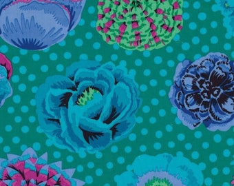 May include: A teal background with white polka dots features a repeating pattern of blue, pink, and green floral designs. The flowers are stylized and have a whimsical, almost cartoonish look.