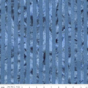 May include: Blue fabric with vertical stripes. The fabric has a textured appearance with varying shades of blue and gray. The stripes are a solid blue color, while the background has a marbled effect. The image includes a ruler with inches.