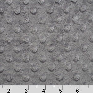 May include: Gray minky fabric with a textured dot pattern. The fabric is soft and plush, perfect for baby blankets, quilts, and other sewing projects.