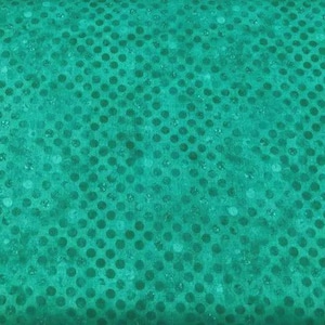 May include: A vibrant teal fabric featuring a repeating pattern of darker teal polka dots. The material has a subtle, slightly mottled texture throughout, creating a consistent visual depth across the entire surface of the textile piece.