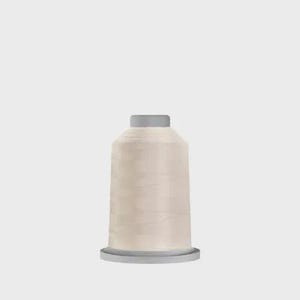 May include: A spool of light beige sewing thread featuring a cylindrical shape with a flat top and base. The thread is wound tightly around the central core, displaying a smooth, consistent texture and a neutral, pale tan color throughout the spool.