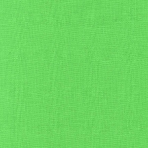 May include: A close-up shot of a solid, bright green fabric. The material has a slightly textured appearance, with a visible weave pattern. The color is a vibrant, eye-catching shade of green, suitable for various crafting and sewing projects.