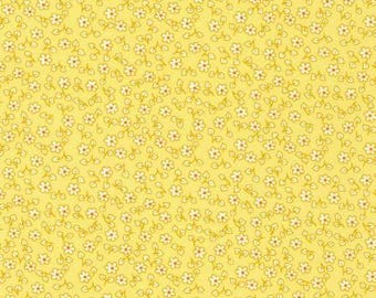 May include: A yellow fabric with a repeating pattern of small white flowers with brown centers and green stems. The flowers are evenly spaced across the yellow background, creating a delicate and cheerful design.