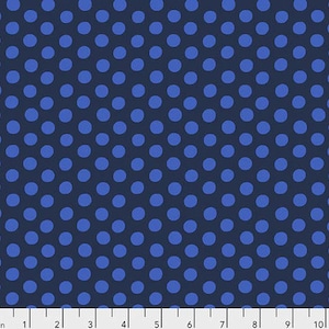 May include: Navy blue fabric with a repeating pattern of medium blue polka dots. The dots are evenly spaced and create a classic, playful design. The fabric is likely cotton or a similar material, suitable for quilting or apparel.