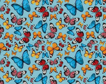 Farfalle in azzurro dalla collezione Tropicana di PBS Fabrics - Tessuto 100% cotone