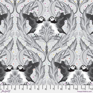 May include: A repeating pattern fabric featuring stylized puffin birds with black, white, and gray feathers, set against a gray floral background. The design includes colorful dots and a ruler along the bottom edge.