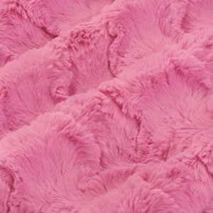 May include: Pink fluffy fabric with a wavy, textured pattern. The fabric is soft and plush, with a luxurious feel.