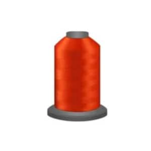 May include: A spool of bright orange thread.