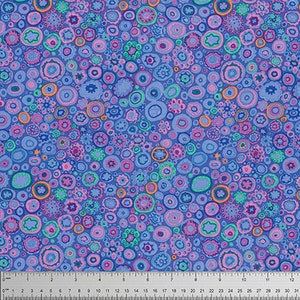 May include: A blue fabric with a repeating pattern of colourful circles and dots. The circles are in shades of pink, purple, green, orange, and blue.