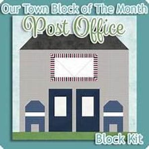 May include: A quilt block pattern titled Our Town Block of The Month Post Office. The design features a gray building with a black roof, two dark blue doors, and two blue mailboxes. A white envelope graphic with a red and blue border is centered.