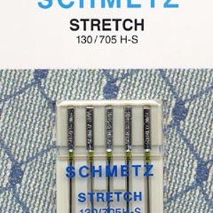 May include: A pack of five silver sewing needles labeled "SCHMETZ STRETCH 130/705H-S 190/14".