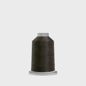 May include: A spool of dark brown sewing thread featuring a cylindrical shape with a flat top and a wider base. The thread is tightly wound around the central core, creating a smooth, uniform texture across the entire surface of the spool.
