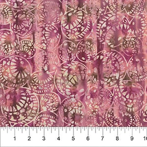 May include: Pink and brown batik fabric with a repeating pattern of circles with intricate designs. The fabric has a soft, flowing texture.