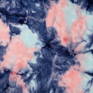 May include: Abstract tie-dye pattern in shades of blue, pink, and white. The colors swirl and blend together to create a unique and eye-catching design.