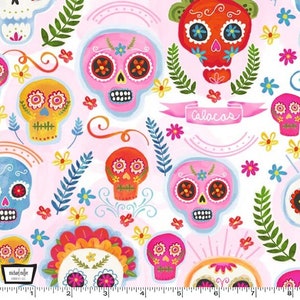 May include: A pink fabric with a repeating pattern of colorful sugar skulls with floral details. The fabric has the text "calaacas" in a pink banner.