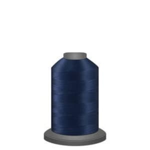 May include: A spool of dark blue thread.