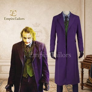 May include: A purple long coat, a green waistcoat, a blue dress shirt, and a dark tie. The ensemble is displayed on a mannequin alongside a depiction of a character wearing the same outfit, featuring the text EmpireTailors in the upper left corner.