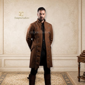 May include: A brown long coat featuring a high collar, double-breasted button closure, and side pockets. The coat is worn over a black shirt with a lace-up neckline and black trousers. The text EmpireTailors is visible in the upper left corner.