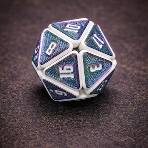 May include: A twenty-sided die featuring white triangular borders and iridescent, textured blue and purple faces. The numbers 16, 8, 10, 17, and 3 are clearly visible in white, embossed font on the individual triangular facets of the gaming die.