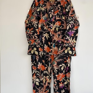 May include: A set of three ceramic mugs with a speckled, matte finish. The mugs are in shades of cream, light gray, and dark gray. Each mug has a simple, minimalist design, perfect for coffee or tea.