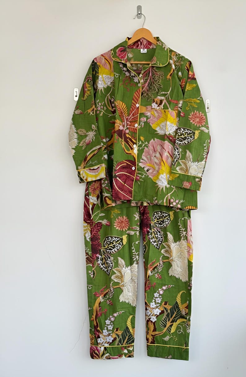 May include: A white ceramic mug with a black handle and the text "But First, Coffee" in a black, bold font. The mug is sitting on a white surface. The mug is approximately 4 inches tall.