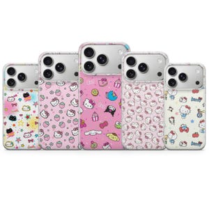 May include: Five phone cases with colorful designs. The cases feature various patterns, including Hello Kitty, strawberries, and other cute illustrations. The cases are in shades of pink, white, and other bright colors.